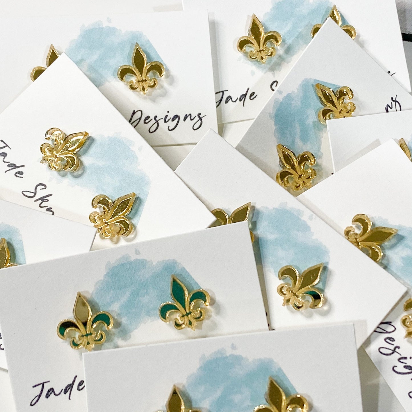Gold mirrored acrylic fleur-de-lis stud earrings